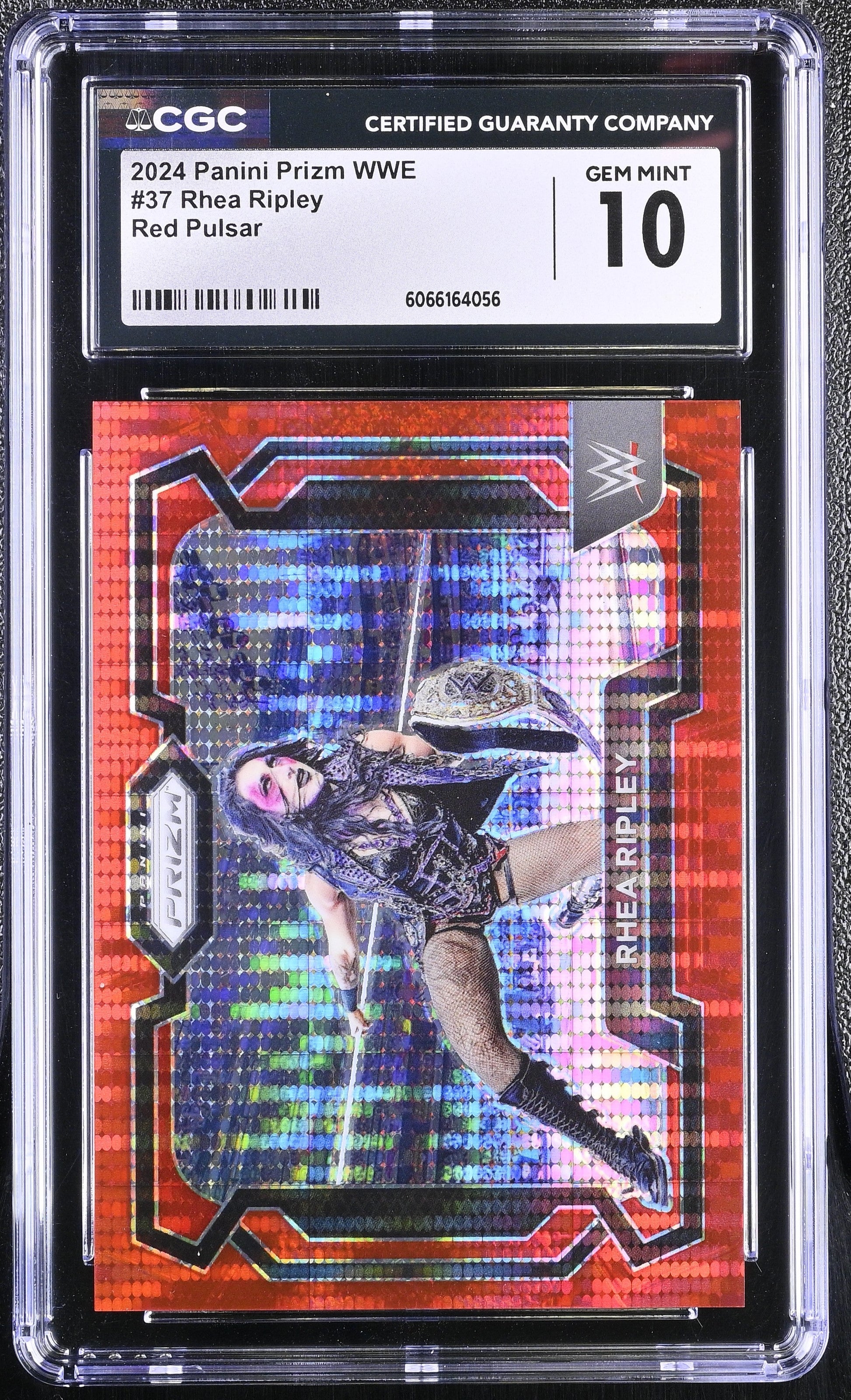 WWE trading card with a red and blue design, featuring a wrestler, in a CGC protective case.